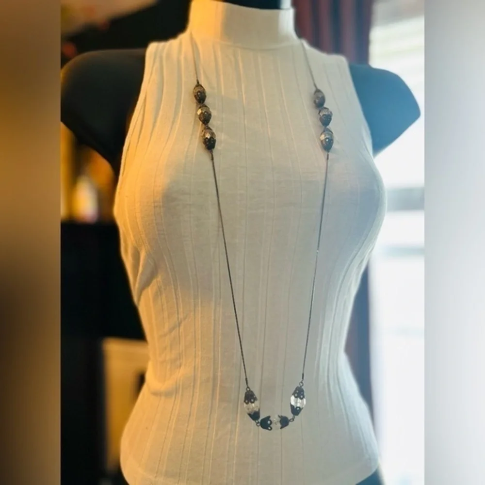 Long silver necklace with beads